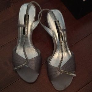 Silver heels with rhinestones.